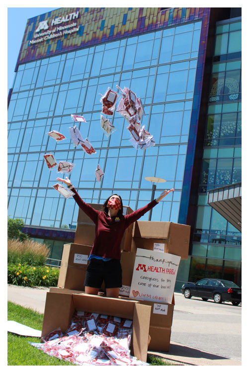 woman throwing covid masks in the air